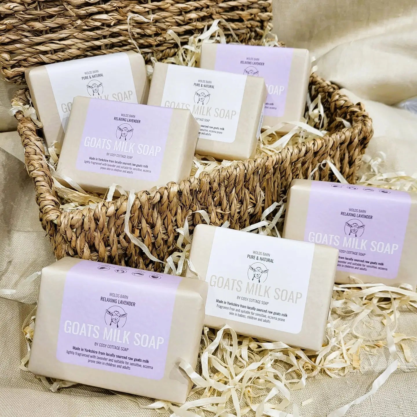 Gentle goats milk soap bars in a woven basket, suitable for babies, children, and adults, fragrance-free and moisturizing.