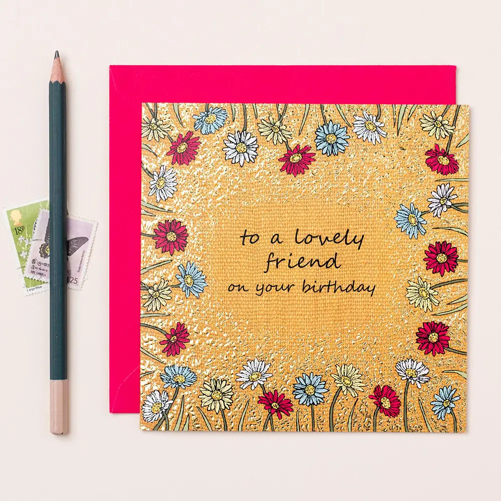 To a Lovely Friend birthday card with floral design and pink envelope.