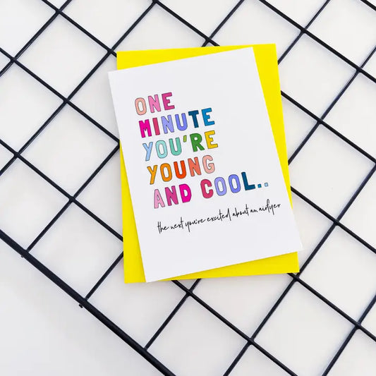 Birthday card with colorful text "One minute you're young and cool, the next you're excited about an airfryer", sealed in eco-friendly packaging.