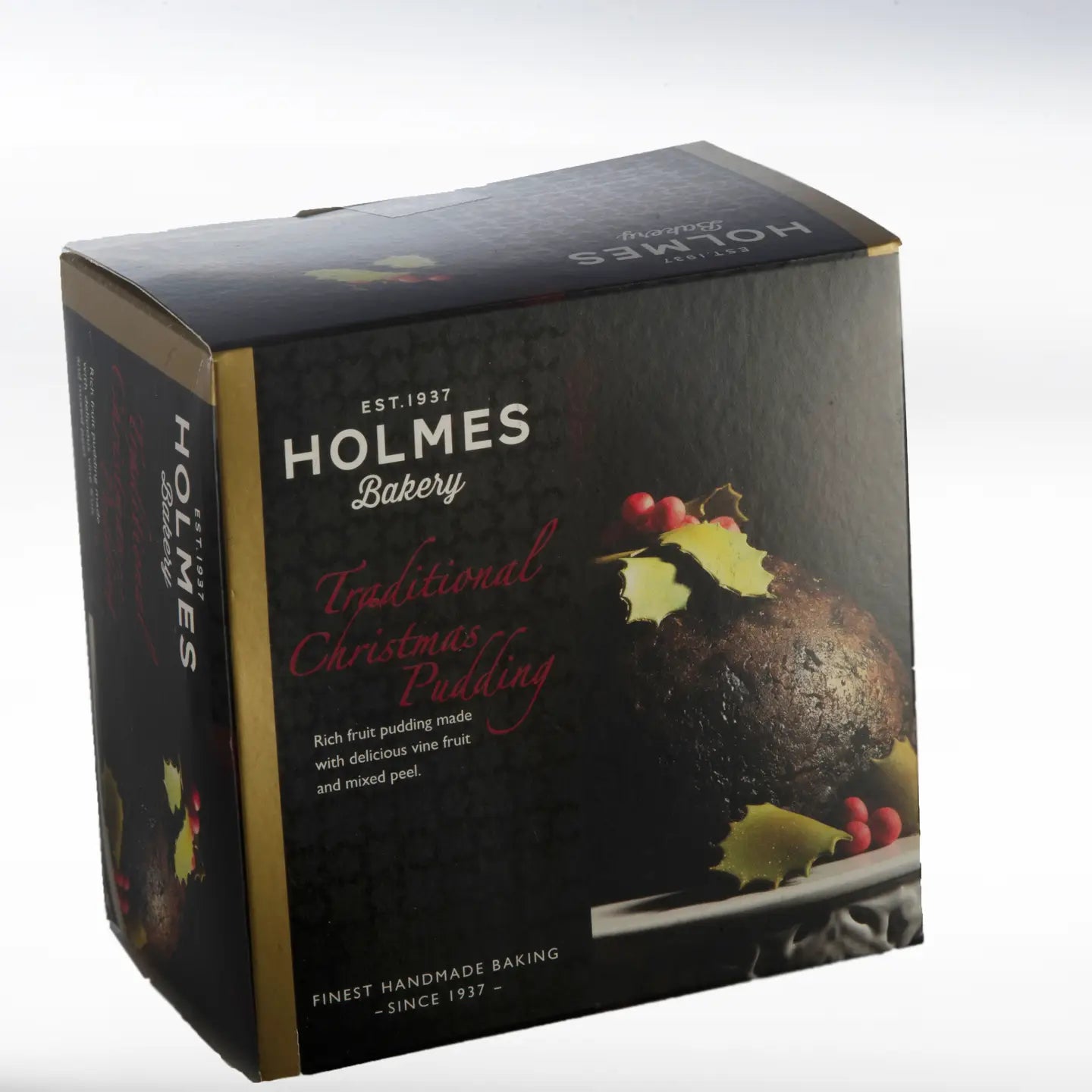 Holmes Bakery Christmas Pudding in packaging, showcasing a traditional festive dessert made with rich fruits and spices.