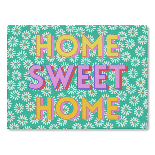Home Sweet Home glass chopping board with floral design, 28.5cm x 39cm.