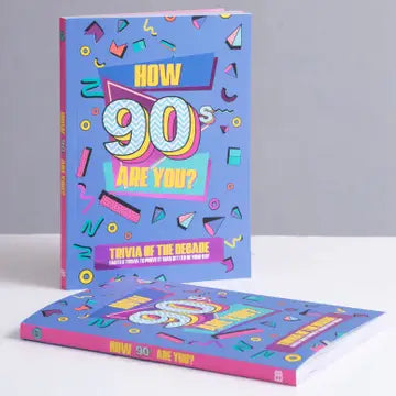 90s Are You? Trivia book with pink-foiled cover featuring vibrant retro design and illustrations.