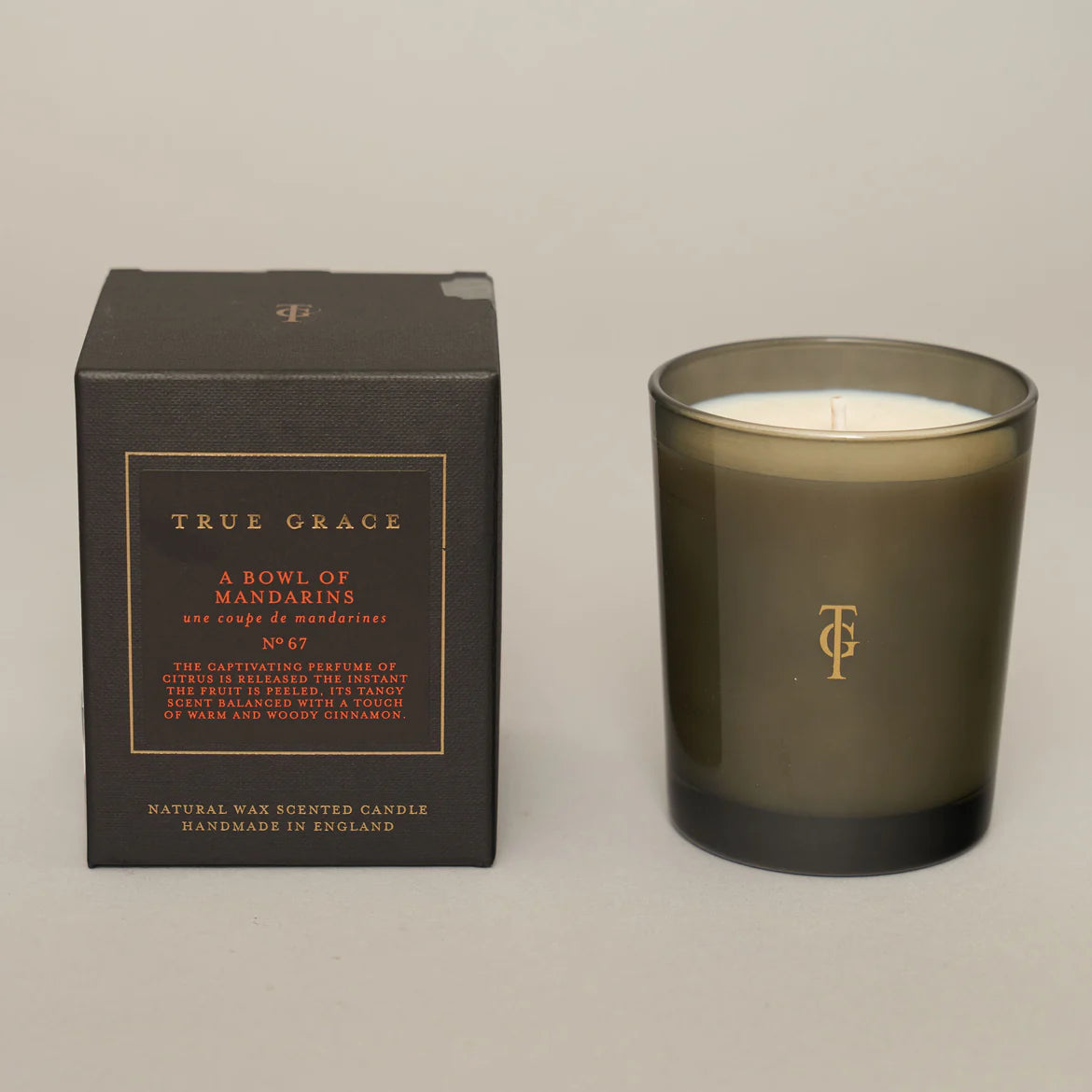 A bowl of mandarins luxury true grace candle 40 hours burn time 