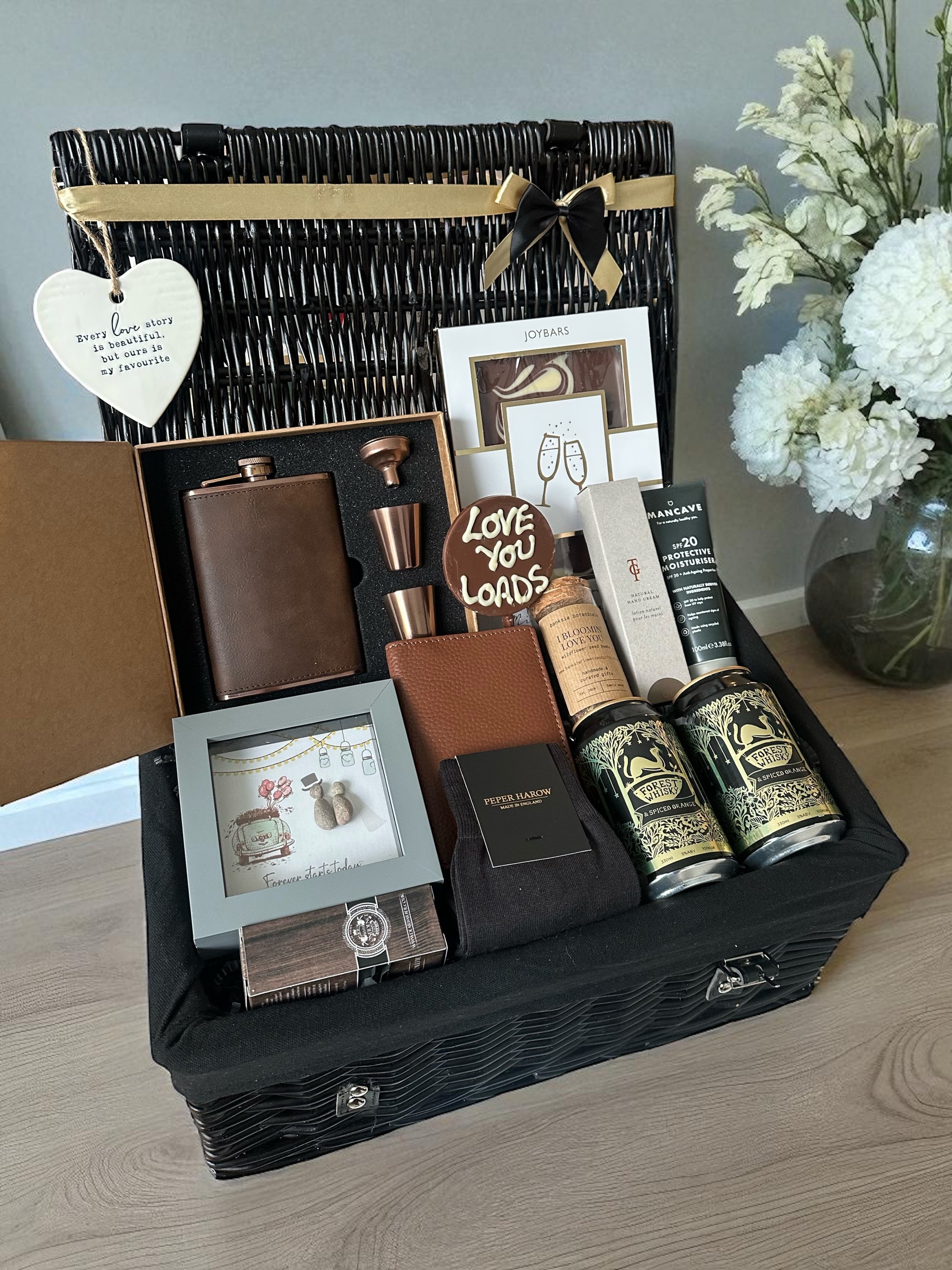 A gift for your husband or partner on the wedding day with hip flask gift set, mixed whisky cans, chocolate, premium socks and more 