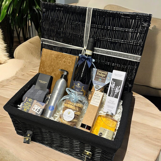 The Gentleman's Gift Hamper with luxury treats including Amarone Red Wine, journal, socks, biscuits, fudge, and more.