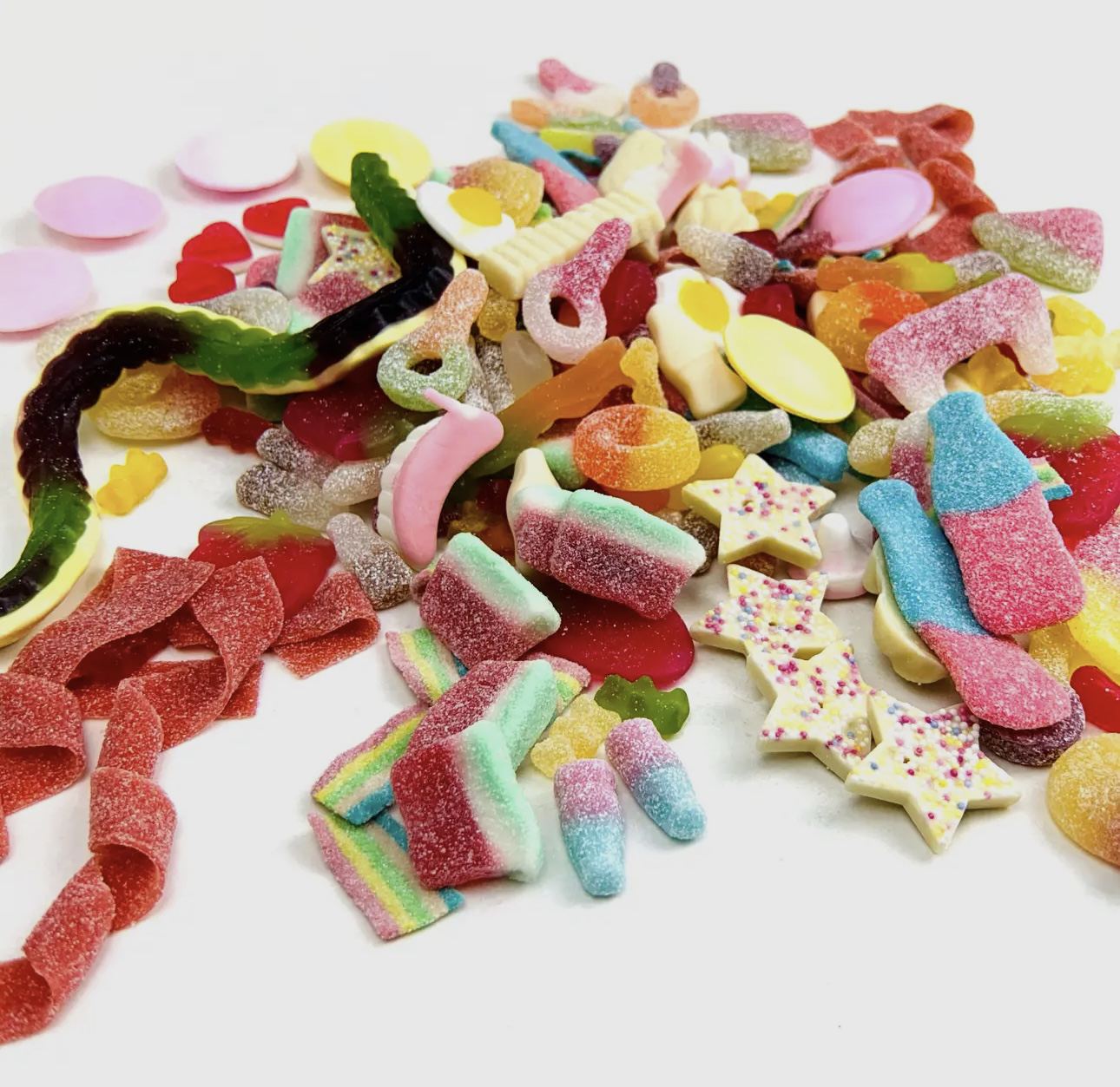 Assorted vegan sweets from TH Vegan Sweets Bag 60g, featuring a variety of colorful candies.