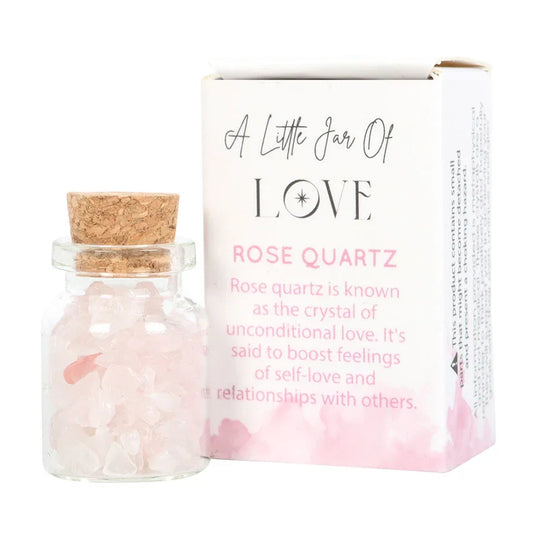 Jar of Love with rose quartz crystal chips in a matchbox, promoting unconditional love and healthy relationships.