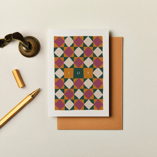 The Joy Christmas Card features a hand-painted geometric design and elegant typography - a stylish way to share festive warmth and holiday cheer.