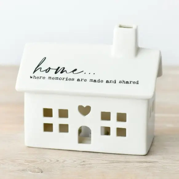 White LED house-shaped container with 'home... where memories are made and shared' 