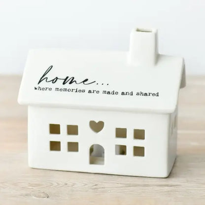White LED house-shaped container with 'home... where memories are made and shared' 