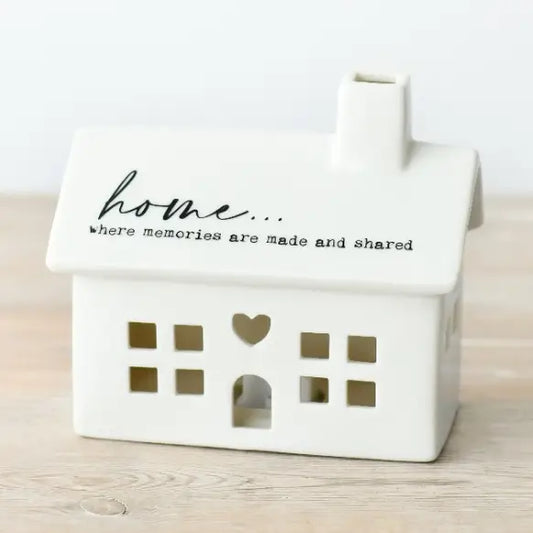 White LED house-shaped container with 'home... where memories are made and shared' 