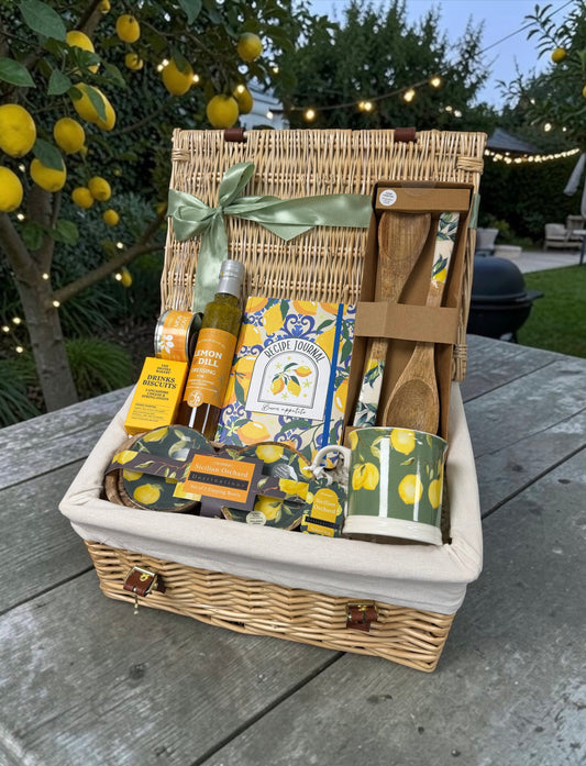 Lemon Grove gift hamper with Limoncello or Prosecco, lemon print mug, dipping bowls, recipe journal, savoury treats and citrus candle.