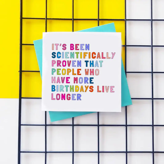 Living Longer Birthday Card with colorful text on recycled board, promoting eco-friendly longevity.