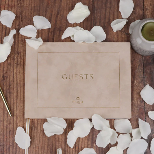 Luxurious velvet guest book with gold foil stamping, gilded edges, and ribbon bookmark, designed to capture heartfelt messages and memories.