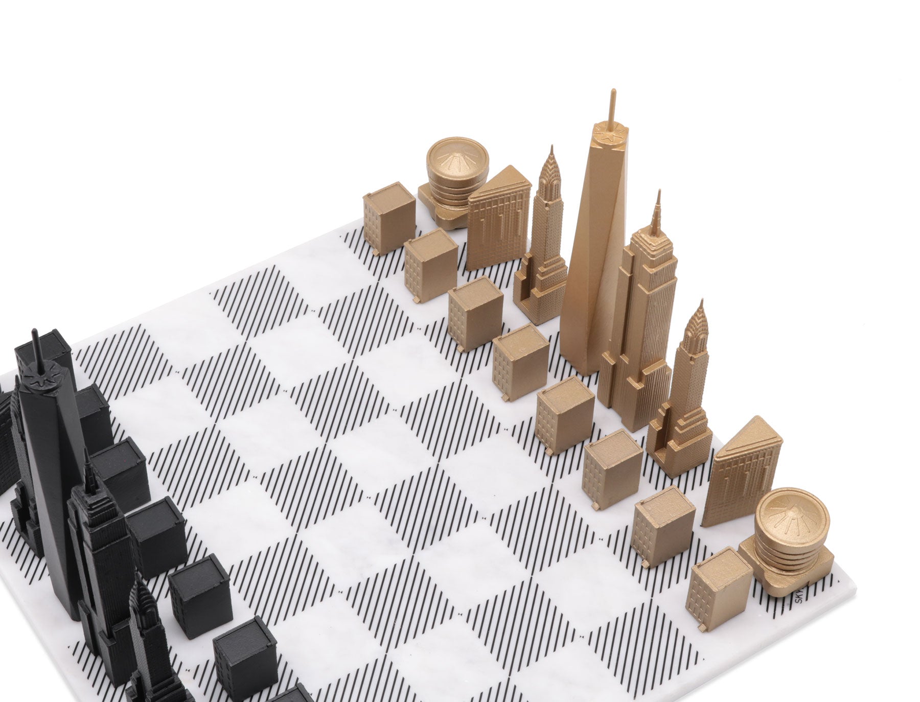 Luxury Bronze Edition Skyline Chess Set with marble board, featuring intricately sculpted bronze chess pieces inspired by iconic city skylines.