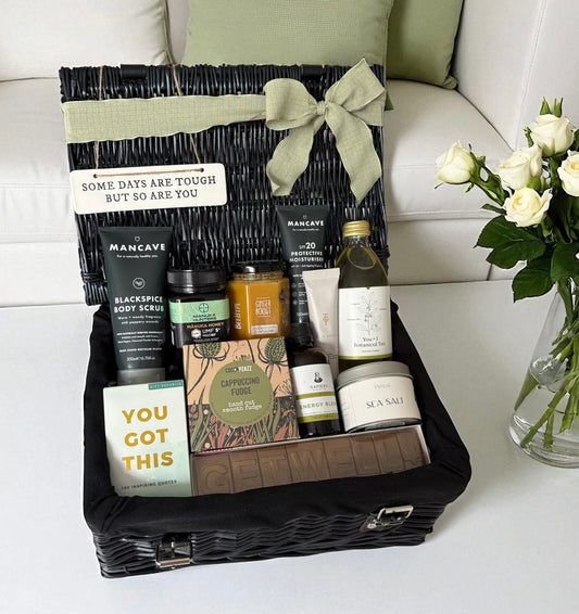 Luxury get well soon hamper for him with skincare, honey, tea, fudge, candle, tonic, and uplifting book – ideal recovery gift.