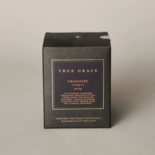 True Grace Orangery classic candle in smoked glass with 40-hour burn time.