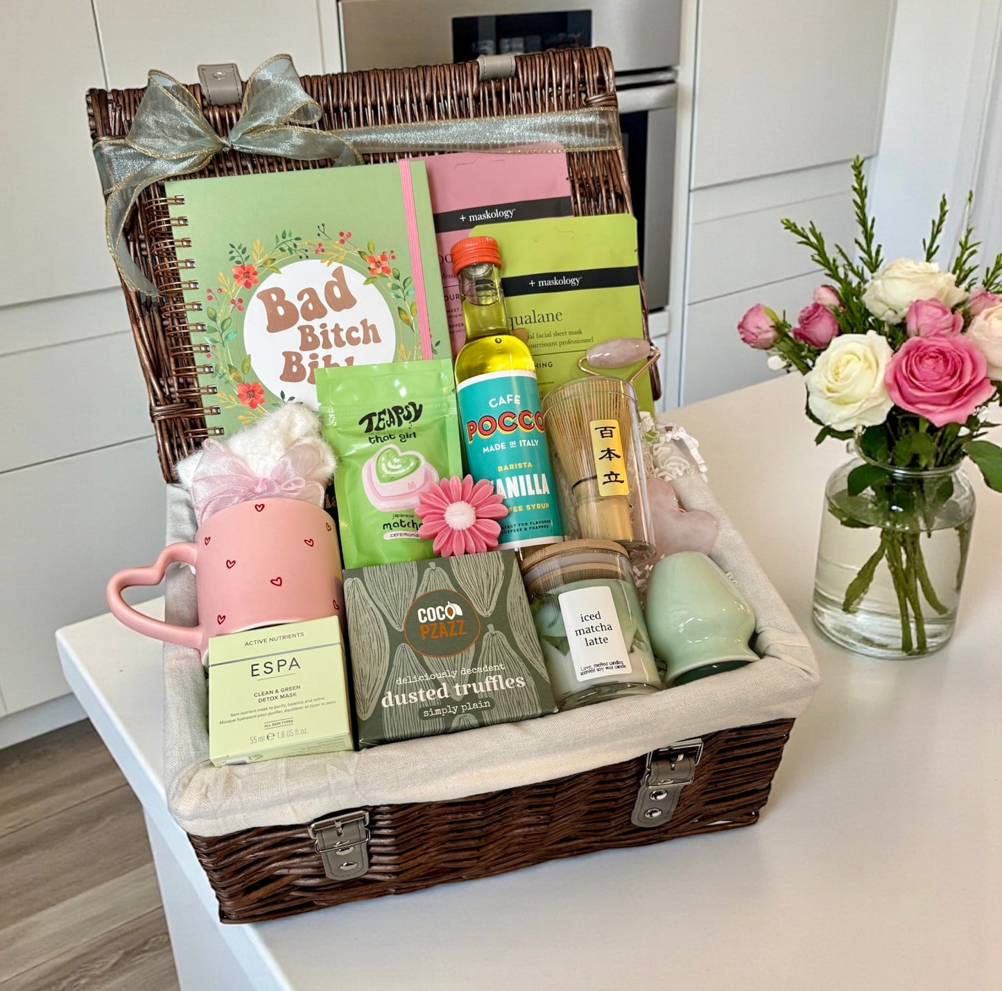 Matcha-themed self care gift hamper with skincare, treats, mug and calming lifestyle items