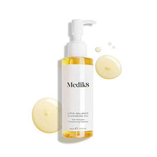 Medik8 Lipid-Balance Makeup Removing Cleansing Oil - 140ml bottle with pump, shown with cleansing oil drops.