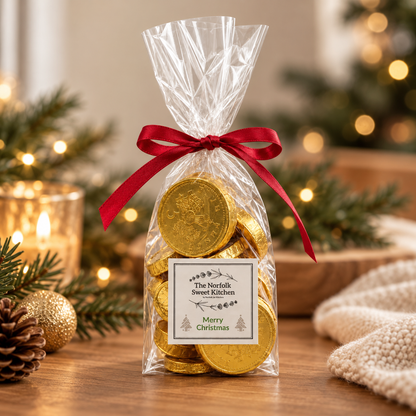 Merry Christmas Milk Chocolate Gold Coins in a ribbon-tied gift bag. A festive gift for stocking fillers, kids, teachers and Christmas tables.