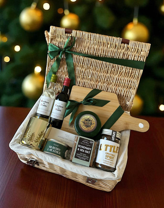 Merry Little Cheeseboard featuring Casillero del Diablo wine miniatures, vintage cheddar truckle, crackers, coffee, wooden board, candles & tea lights.