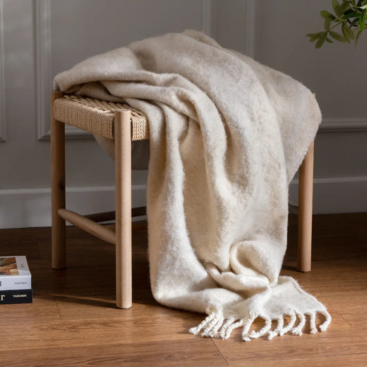 Meta Throw with abstract jacquard shapes on soft faux mohair, finished with twisted tassel edging, ideal for modern, minimalist home décor.