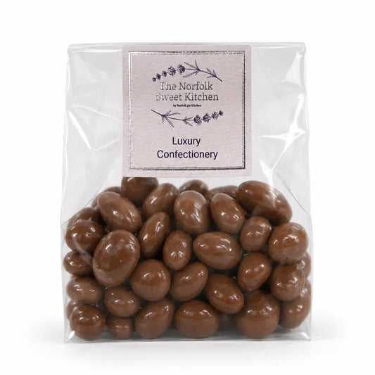 Juicy raisins coated in smooth milk chocolate, perfect as a classic sweet treat or addition to gift hampers.