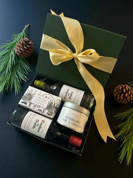 Mini Wines Christmas Gift Box featuring Casillero del Diablo Cabernet Sauvignon and Sauvignon Blanc miniatures, sparkling lime & ginger candle, and London Soap.