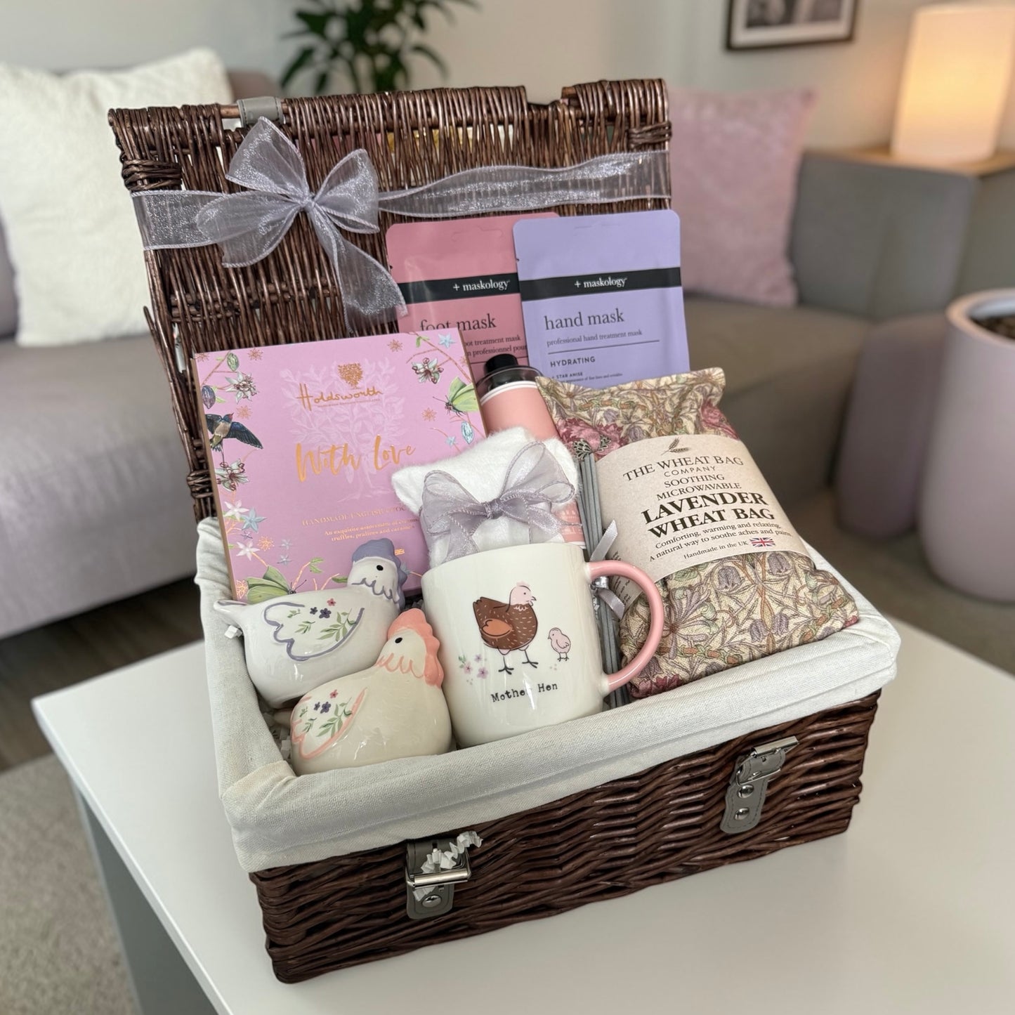 Mother Hen gift hamper with hen mug, lavender wheat bag, pamper masks, chocolates and cosy treats.
