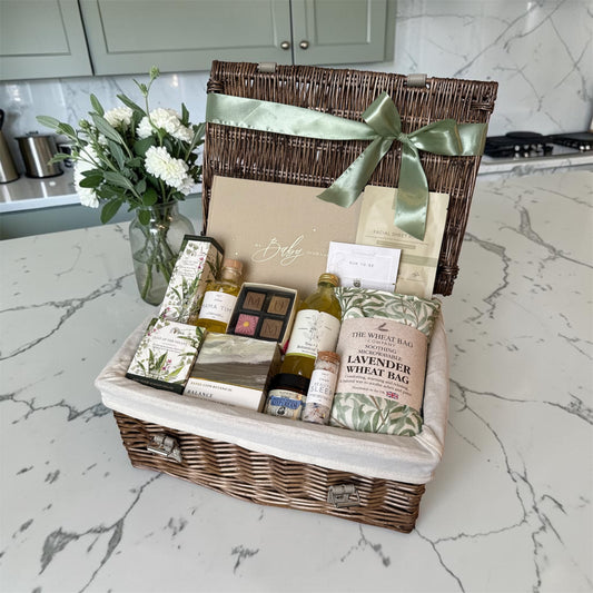 Luxury mum to be pregnancy hamper with baby journal, skincare, lavender wheat bag, candle, belly oil, chocolates, tea and mum bracelet gift.