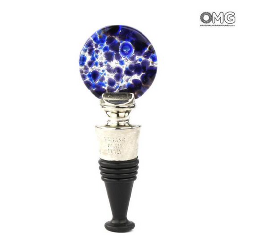 Murano glass blue bottle stopper with elegant swirl design.