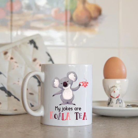 Cute "My Jokes Are Koala Tea" novelty mug with humorous koala design, perfect gift.