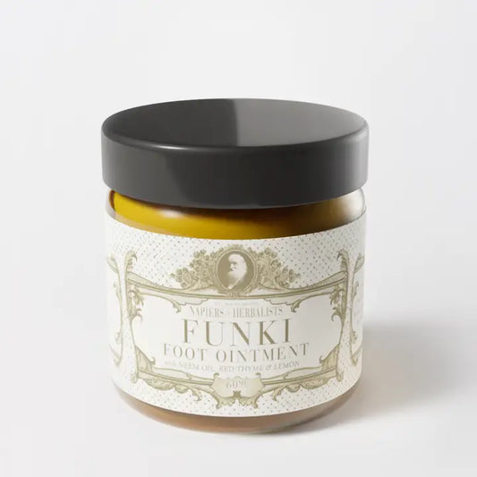 Funki Foot Ointment jar with dark lid, designed for relief from itchy, smelly feet.