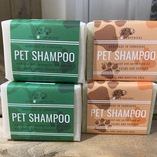 Natural pet shampoo bar with eco-friendly ingredients in two fragrances for healthy coat care.