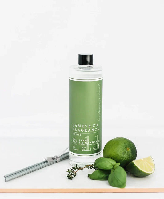 Fresh & Fragrant Lime & Basil Reed Diffuser Refill 200ml with grey reeds and lime.
