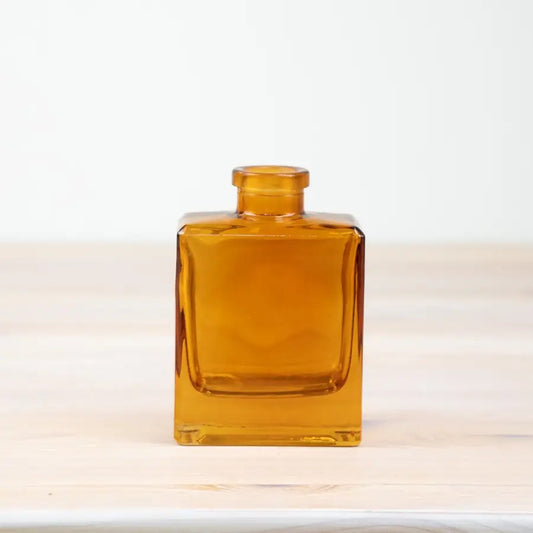 Ochre glass square shaped vase, amber color, 10.5cm tall.