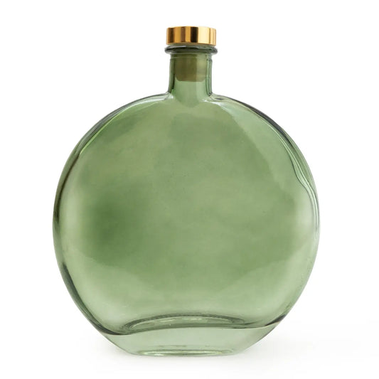 Olive green oval reed diffuser with black reeds, filled with fig and apple–scented fragrance oil.