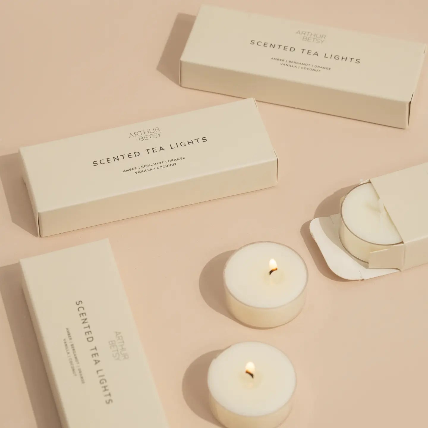 Amber, Bergamot, Orange, Vanilla & Coconut scented tea light candle set. 