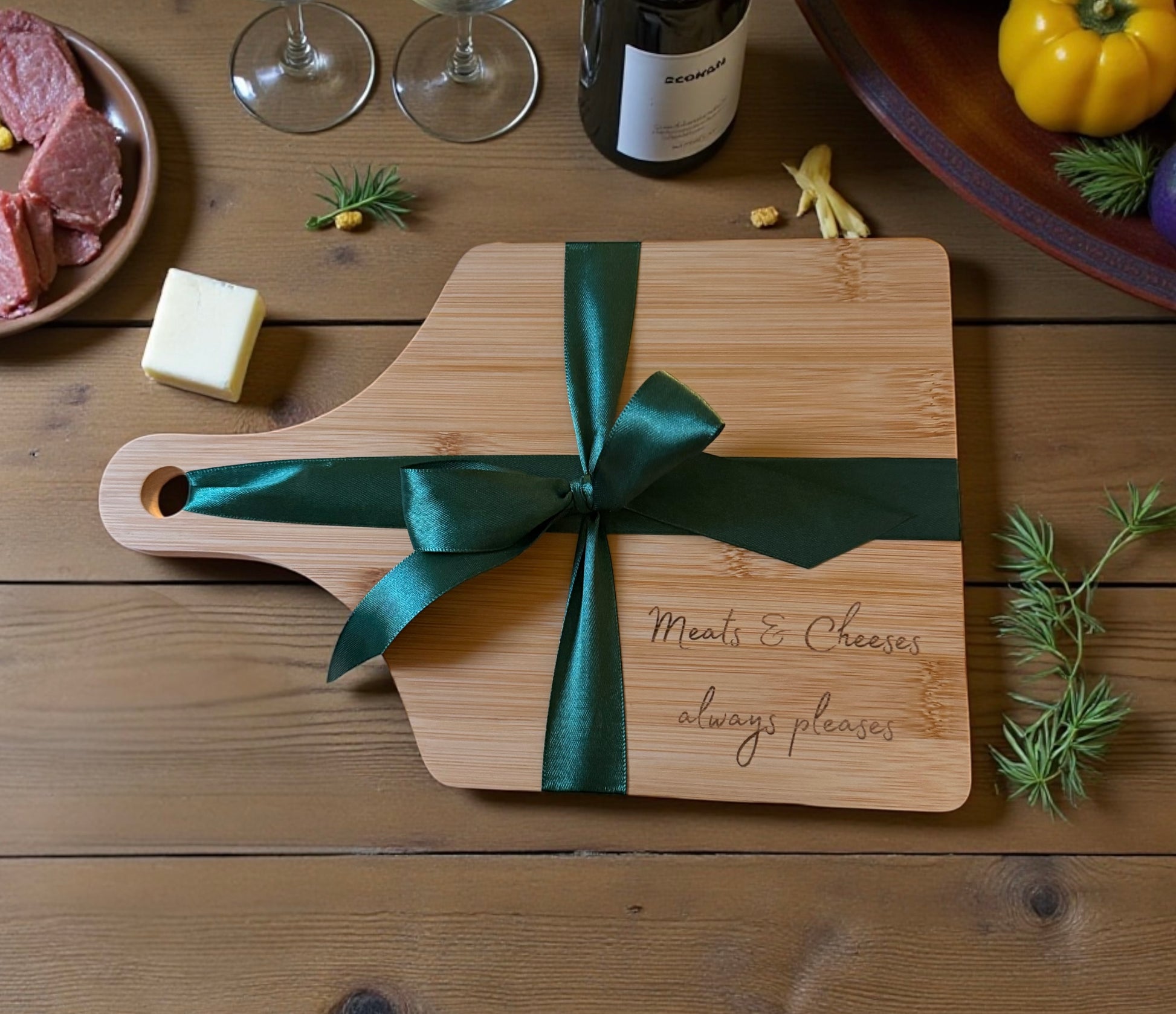 Wooden cutting board with a green ribbon on a wooden surface, surrounded by food items.