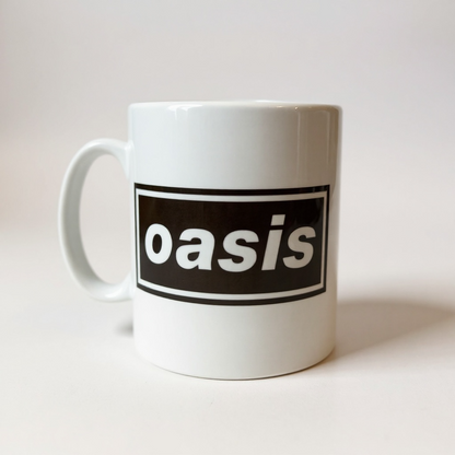 White mug with 'oasis' logo on a white background