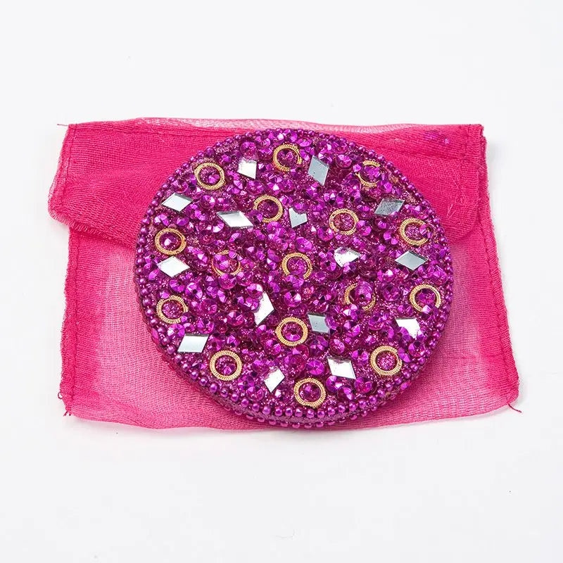 Pink mosaic handbag mirror with pink sequins and gold rings.