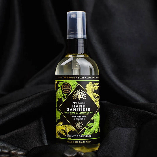 Wild Lime and Lemongrass Hand Sanitiser with 75% alcohol in 100ml bottle on dark background.