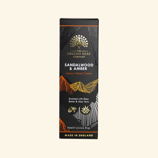 Radiant Sandalwood and Amber Hand Cream packaging with cedar and pine notes.
