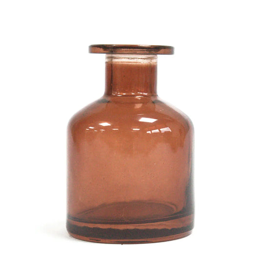 Amber Round Alchemist reed diffuser glass bottle for aromatherapy oils.