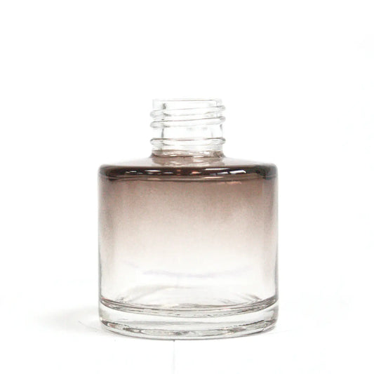 Miniature charcoal round reed diffuser bottle for aromatherapy.
