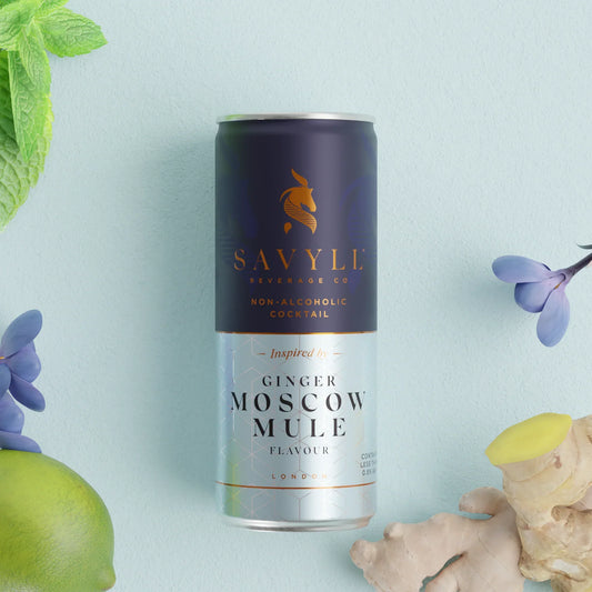Non-Alcoholic Moscow Mule can with ginger, lime, and mint on a light background.