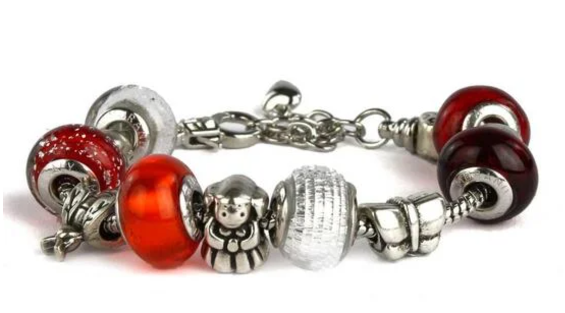 Chrome bracelet with handmade red Murano glass beads and metal figures.