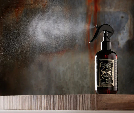 Luxury Sea Salt Texturising Spray bottle on wooden surface, spraying mist, 250ml size.