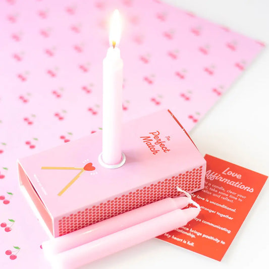 Love affirmation candles in a box with unscented pink candles and mantra card.