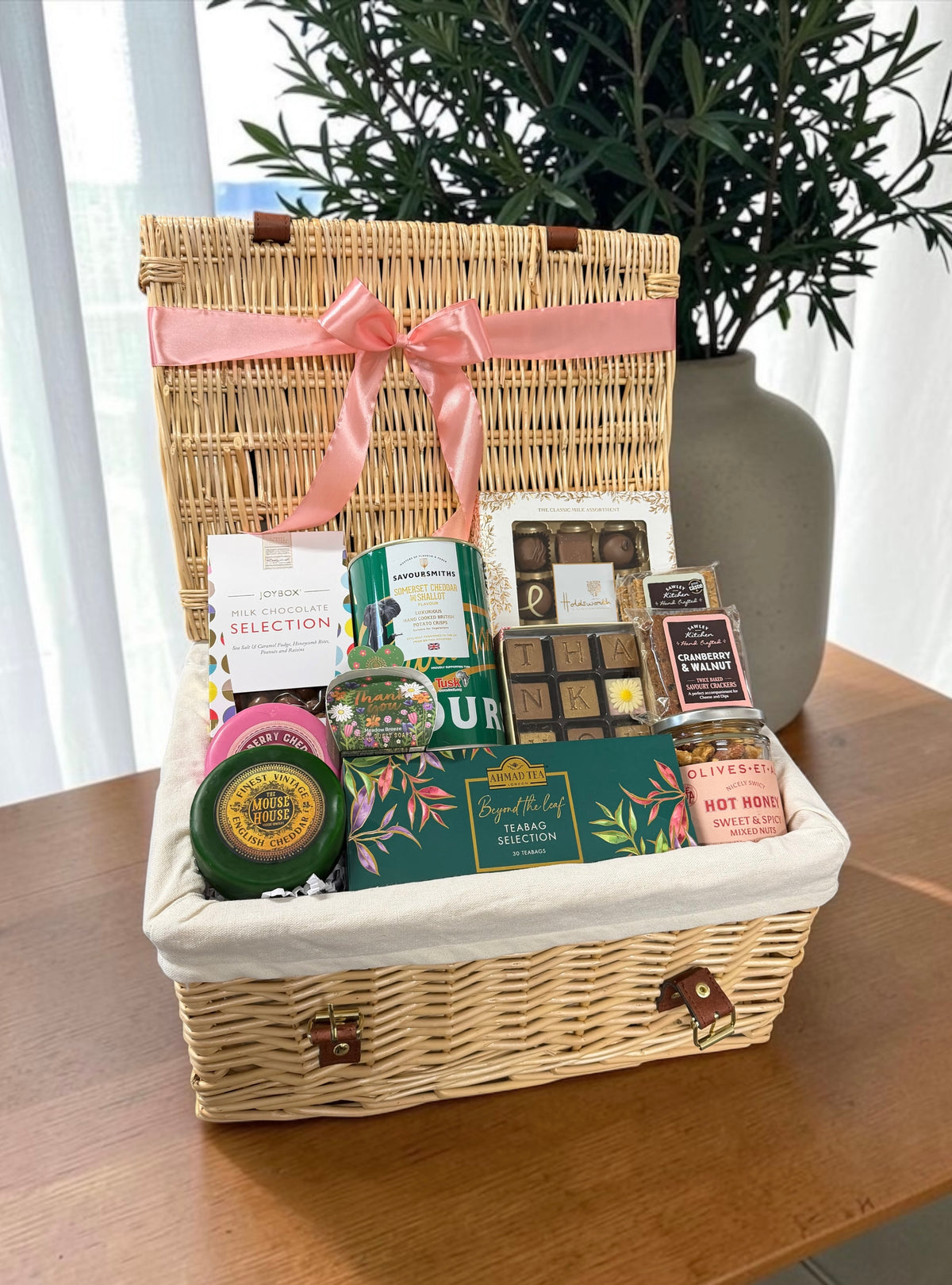 Sharer Thank You Gift with chocolates, tea, cheese, crackers, crisps, hot honey nuts and thank you hand soap.